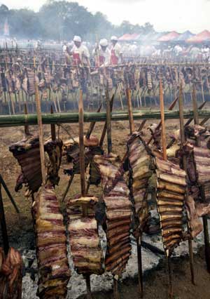 Paraguayans barbeque beef during an attempt to create the world