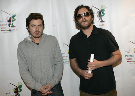 Actors Casey Affleck (L) and Joaquin Phoenix pose for photographers as they arrive for a staged reading of 