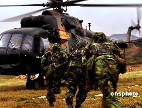 A military exercise code-named 'Vanguard-2008' that partly opened to foreign students studying at China's military academies concluded in the central Henan Province on Tuesday, winning applause from the foreign observers.