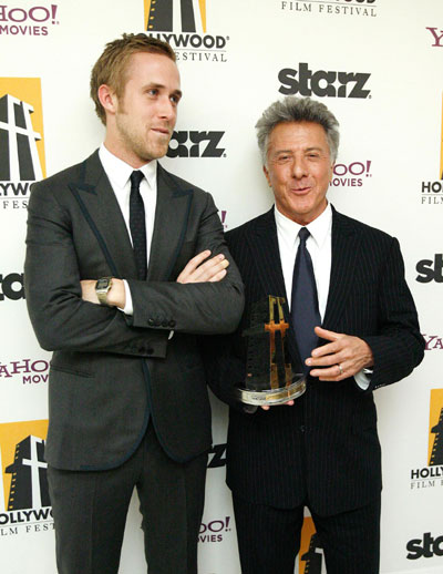 Actor Dustin Hoffman (R) poses with presenter Ryan Gosling after accepting the Career Award at the 12th annual Hollywood Awards gala in Beverly Hills, California October 27, 2008.