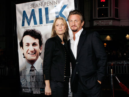 Cast member Sean Penn and his wife, actress Robin Wright Penn, pose for photographers as they arrive for the world premiere of the film 'Milk,' at the Castro Theatre in San Francisco, California October 28, 2008.