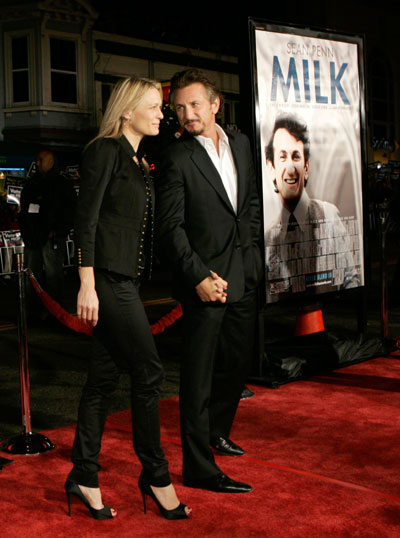 Cast member Sean Penn and his wife, actress Robin Wright Penn, pose for photographers as they arrive for the world premiere of the film 'Milk,' at the Castro Theatre in San Francisco, California October 28, 2008.