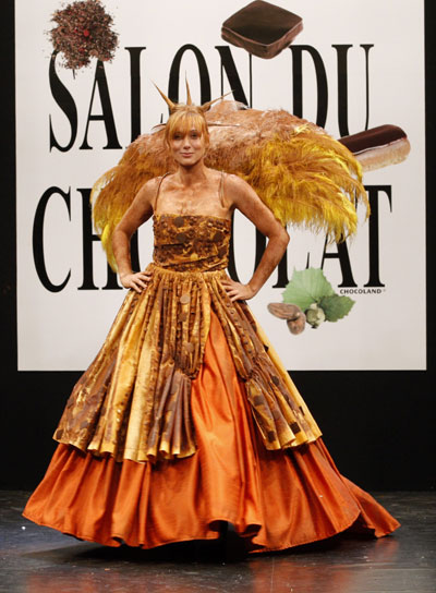 French TV host Frederique Courtadon presents a creation by Jeremy Beuret and Canonica at the 14th Salon du Chocolat (Paris Chocolate Show) in Paris October 28, 2008.