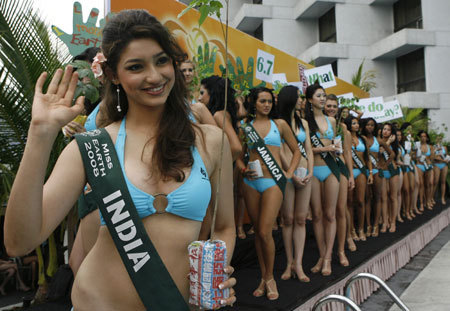 Miss Earth 2008 contestant Tanvi Vyas, 22, of India, waves to photographers during media presentations in Manila October 28, 2008. Eighty-five beauties from around the world declared their personal environmental campaigns, with the theme for this year's competition focused on 'green lifestyle'. 
