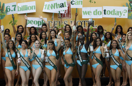 Miss Earth 2008 contestants display placards during media presentations in Manila October 28, 2008. Eighty-five beauties from around the world declared their personal environmental campaigns, with the theme for this year's competition focused on 'green lifestyle'. 