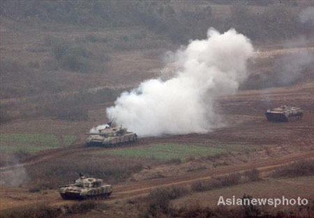 Armored vehicles participate an attacking drill in Central China's Henan Province October 28,2008. The armored brigade stationed in Jinan of East China's Shandong Province conducted a filed operation on attacking in mountainous area. [Asiannewsphoto]