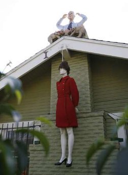 A mannequin portraying US Republican vice-presidential nominee Alaska Governor Sarah Palin hangs by a noose as a mannequin portraying US Republican presidential nominee Senator John McCain protrudes from the chimney of a private residence in West Hollywood, California October 27, 2008. Part of a Halloween display, the likenesses drew complaints on Monday, but local officials said the homeowner was covered by free speech rights. [Agencies]