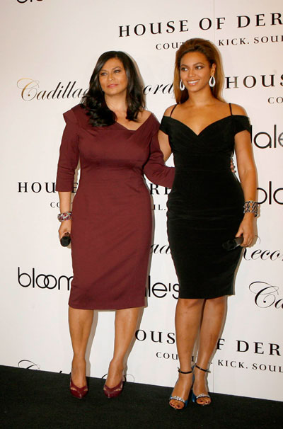 Singer Beyonce (R) smiles with her mother Tina Knowles during a promotion for her dress line 'House of Dereon' inspired by her work in the film 'Cadillac Records' at a department store in New York, October 28, 2008.