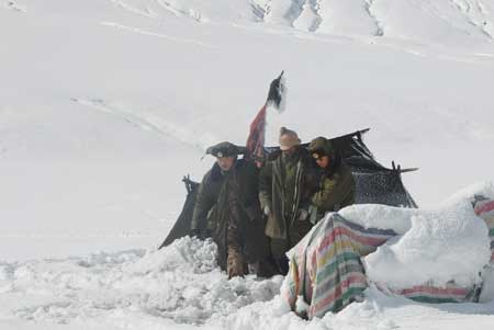 Soldiers rescue a farmer stranded due to heavy snow in Shannan prefecture, southwest China&apos;s Tibet Autonomous Region Oct. 30, 2008.