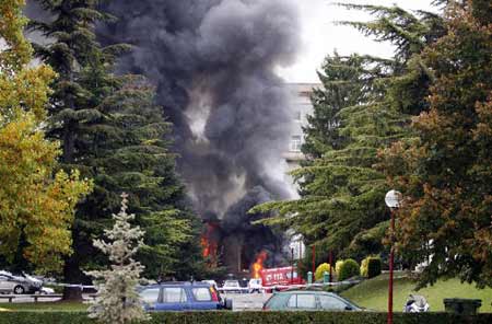 A column of smoke rises above the University of Navarre building following a car bomb blast in Pamplona, October 30, 2008. A car bomb exploded in a University of Navarre car park in the northern Spanish city of Pamplona on Thursday, slightly injuring 17 people, after a warning call in the name of Basque separatist rebels ETA, the government said. 