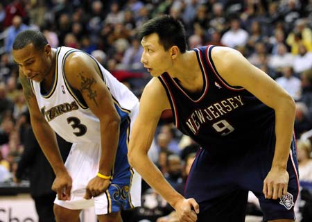 Yi Jianlian (R) of the New Jersey Nets reacts during the NBA basketball game against Washington Wizards at Verizon Center, Washington, DC, USA, Oct. 29, 2008. Nets won 95-85.