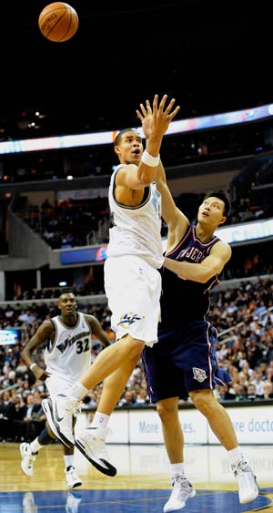 Yi Jianlian (R) of the New Jersey Nets defends as JaVale McGee of Washington Wizards goes up to shoot during their NBA basketball game at Verizon Center, Washington, DC, USA, Oct. 29, 2008. Nets won 95-85.