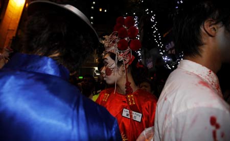 Revellers celebrate Halloween at Lan Kwai Fong, one of the most famous destinations for tourists in Hong Kong, south China, Oct. 31, 2008.