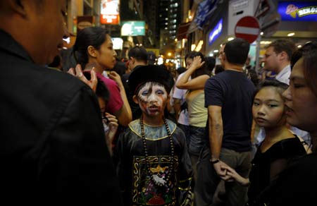 Revellers celebrate Halloween at Lan Kwai Fong, one of the most famous destinations for tourists in Hong Kong, south China, Oct. 31, 2008.