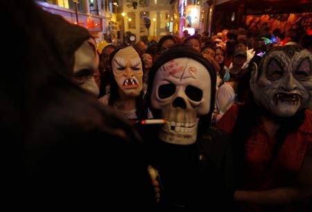 Revellers celebrate Halloween at Lan Kwai Fong, one of the most famous destinations for tourists in Hong Kong, south China, Oct. 31, 2008. 