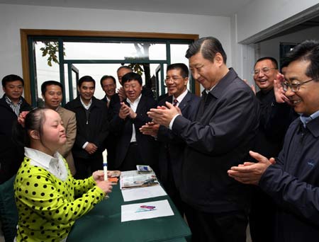 Chinese Vice President Xi Jinping (3rd R), member of the Standing Committee of the Political Bureau of the Communist Party of China (CPC) Central Committee, pays a visit to the disabled at a nursing home in Yanshan village of Dingqiao Town in Hangzhou, capital of east China's Zhejiang Province, Oct. 31, 2008. [Xinhua]