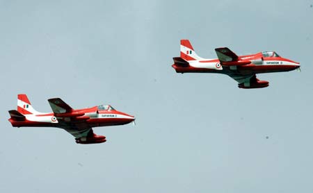 The first two planes of Suryakiran, or sun rays in Hindi, an aerobatics demonstration team of the Indian Air Force, arrive in Zhuhai, south China's Guangdong Province, Oct. 31, 2008. [Xinhua]