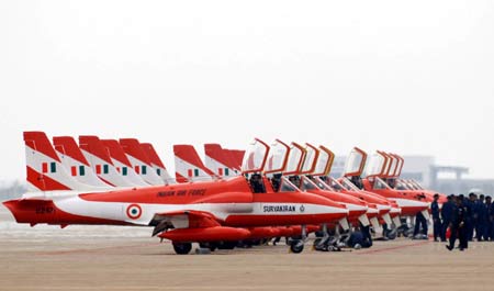 Planes of Suryakiran, or sun rays in Hindi, an aerobatics demonstration team of the Indian Air Force, arrive in Zhuhai, south China's Guangdong Province, Oct. 31, 2008.[Xinhua]