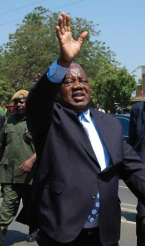 File photo taken on Oct. 24, 2008 shows Rupiah Banda (front) waving to his supporters in Lusaka, capital of Zambia. Rupiah Banda was sworn in on Nov. 2 as Zambian president in Lusaka, after he narrowly won the presidential by-election held on Thursday.