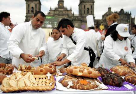  Bakers prepare "dead bread" at the Zocalo square during a bread-making contest special for the day of the dead in Mexico City Nov. 2, 2008. 