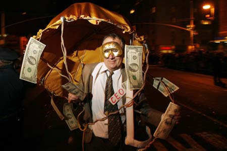 A reveler dressed in financial themed costumes marches in the annual Greenwich Village Halloween Parade in New York, October 31, 2008.