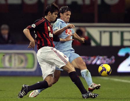 AC Milan's Kaka (L) fights for the ball with Napoli's Christian Maggio during their Italian Serie A soccer match at the San Siro stadium in Milan Nov. 2, 2008. 