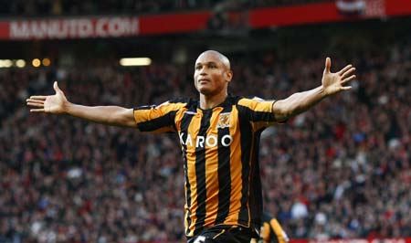 Hull City's Daniel Cousin celebrates after scoring during their English Premier League soccer match against Manchester United in Manchester, northern England, November 1, 2008.