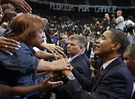 US Democratic presidential nominee Senator Barack Obama greets a supporter during a rally in Jacksonville, Florida, November 3, 2008. [Agencies]