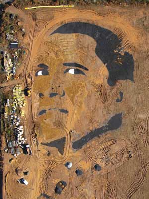 An aerial view of the face of U.S. Democratic presidential nominee Senator Barack Obama (D-IL), sculpted from gravel and sand by US artist Jorge Rodriguez-Gerada, along the Barcelona beachfront, November 3, 2008.