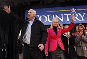 Republican presidential nominee Senator John McCain(L) and his wife Cindy wave to the crowd at the end of a campaign rally in Wallingford, Pennsylvania November 2, 2008.[Brian Snyder/Reuters] 