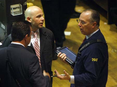 Traders work on the floor of the New York Stock Exchange November 4, 2008.