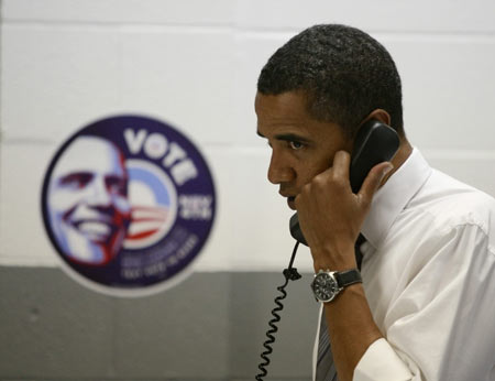 U.S. Democratic presidential nominee Senator Barack Obama (D-IL) speaks to a potential voter during his visit to a United Auto Workers Union call center for Obama&apos;s presidential election campaign in Indianapolis, Nov. 4, 2008. 