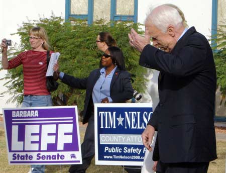 U.S. Republican presidential nominee Senator John McCain (R-AZ) fixes his hair after casting his ballot at his polling place in Phoenix, Arizona Nov. 4, 2008. [Xinhua/Reuter]