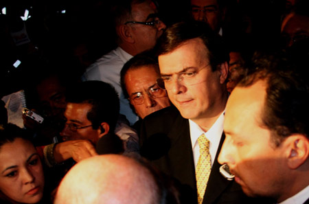 Mayor of Mexico City Marcelo Ebrard (2nd. L) visits the site of a plane crash in Mexico City, capital of Mexico, Nov. 4, 2008. 