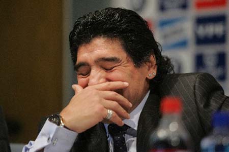 Diego Maradona reacts at the news release conference on Tuesday. Soccer legend Diego Maradona said that he had 'fulfilled a dream' after officially taking over Argentina's national soccer team on Tuesday.