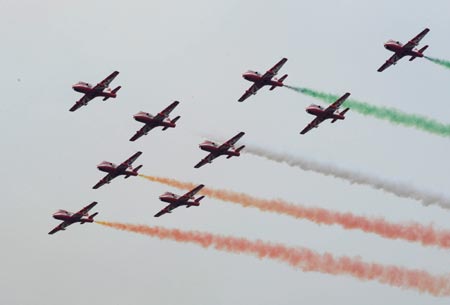 Aircrafts of the Suryakirans (Sun Rays), the aerobatic team of the Indian Air Force, perform during the 7th China International Aviation and Aerospace Exhibition in Zhuhai, south China&apos;s Guangdong Province, Nov. 4, 2008. The six-day exhibition opened on Tuesday with about 600 aviation and aerospace manufacturers from 35 countries and regions attending.(Xinhua/Lu Hanxin)