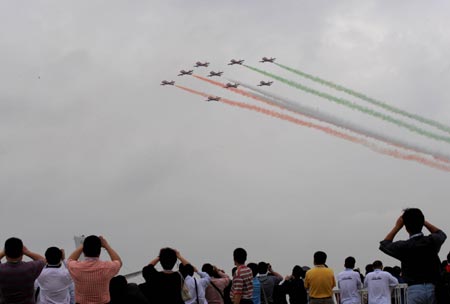Aircrafts of the Suryakirans (Sun Rays), the aerobatic team of the Indian Air Force, perform during the 7th China International Aviation and Aerospace Exhibition in Zhuhai, south China&apos;s Guangdong Province, Nov. 4, 2008. The six-day exhibition opened on Tuesday with about 600 aviation and aerospace manufacturers from 35 countries and regions attending.(Xinhua/Lu Hanxin) 