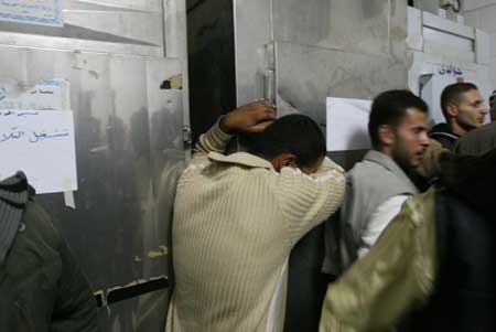 Palestinians mourn at the mortuary of Nasser hospital in Khan Younis in southern Gaza Strip Nov. 5, 2008.