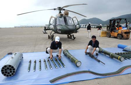 Staff member show the armament of the Z-11 helicopter during the Zhuhai Air Show, November 5, 2008. Z-11 is a type of light observation and armed helicopter built in China.