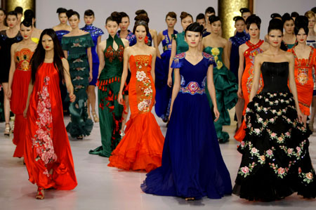 Models present creations for NE TIGER 2009 Haute Couture Show at China Fashion Week in Beijing, November 5, 2008. 