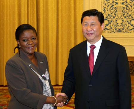 Chinese Vice President Xi Jinping (R) shakes hands with Zainab Hawa Bangura, Minister of Foreign Affairs and International Cooperation of Sierra Leone, during their meeting at the Great Hall of the People in Beijing, capital of China, on Nov. 6, 2008.