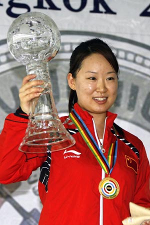 China's Wu Liuxi holds her trophy during the awarding ceremony of the women's 10m air rifle event at the 2008 Shooting World Cup Final held in Bangkok, Thailand, Nov. 5, 2008. Wu Liuxi shot 502.1 points to claim the title of the event