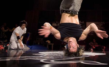 Cico (R) of Italy performs as Baek of South Korea watches during the Red Bull BC One break-dance competition, in which 16 B-Boys from across the world compete in one-on-one knockout battles to determine the winner, in Paris November 5, 2008. 