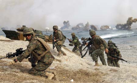 Soldiers from South Korean Marine Corps and U.S. Marine conduct the U.S.-South Korea joint amphibious landing operation drill Along the shore in Pohang, about 370 km (230 miles) southeast of Seoul, November 6, 2008.