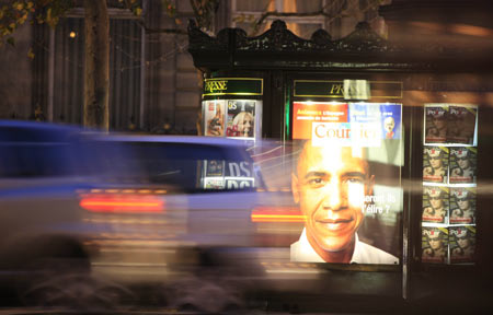 Cars pass by a newsstand in Paris, France, Nov. 5, 2008. French public showed great concern for Tuesday's U.S. election, and the French media put the news of the U.S. election on their front pages. [Xinhua]