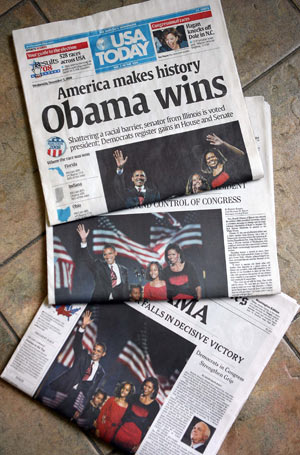 Photo taken on Nov. 5, 2008 shows the front pages of 'USA Today', 'The Washington Post', and 'The New York Times'. After Barack Obama was elected to be next U.S. president, U.S. media published photos and articles of the historic event on their front pages. [Xinhua]