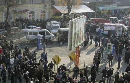 Investigators work on a scene of an explosion outside the main market in the southern Russian city of Vladikavkaz, November 6, 2008. 