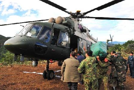 Copters drop relief to isolated areas in landslide-hit Yunnan