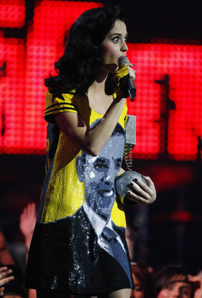 U.S singer Katy Perry collects the New Act award whilst wearing a dress showing U.S. President-elect Barack Obama during the MTV Europe Music Awards ceremony in Liverpool, northern England, November 6, 2008.