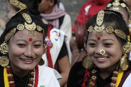 Two women of a Nepalese ethnic cultural group smile during the International Folk Music Festival in Kathmandu, capital of Nepal, on Nov. 7, 2008. 